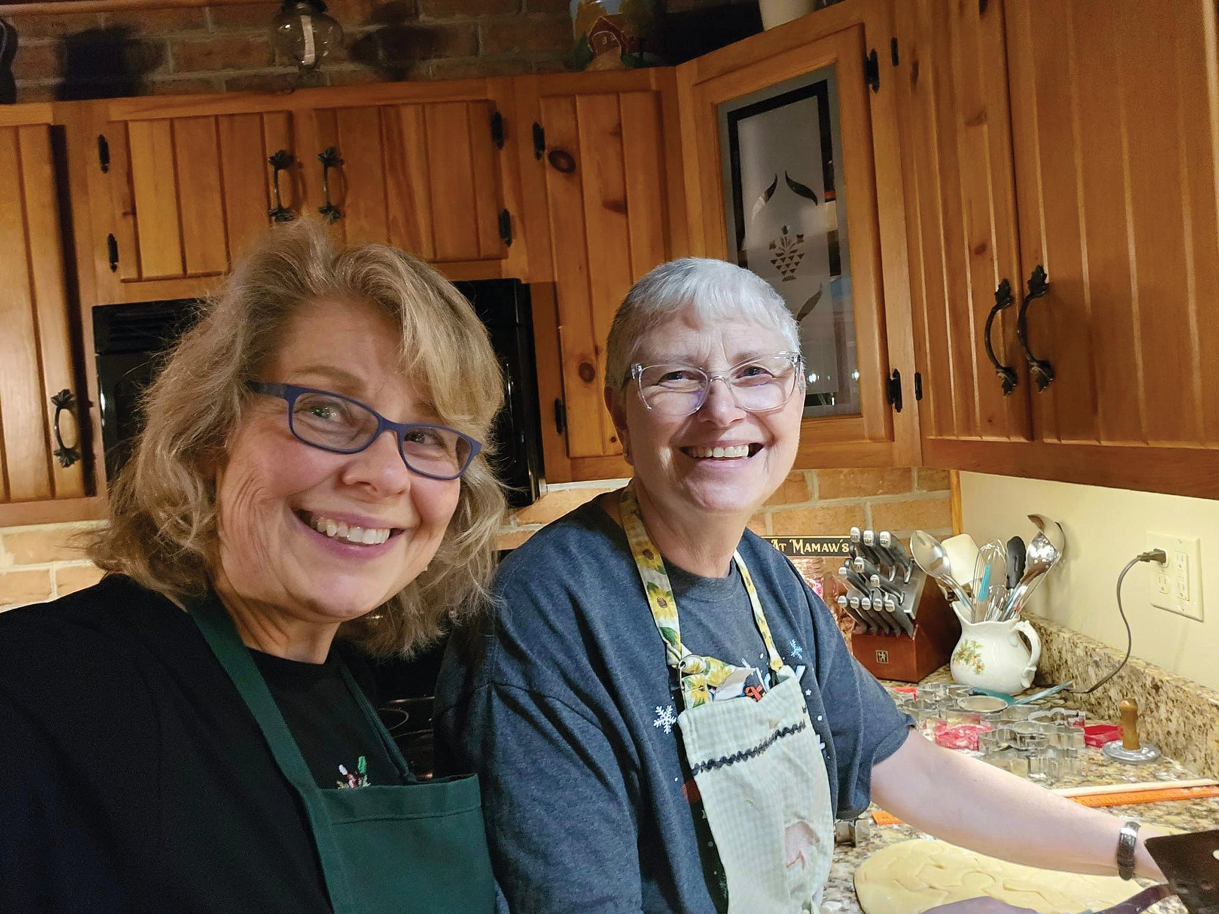 Somerset Rural Electric Cooperative members Michelle Kimmel, left, and Pam Weimer, have baked dozens of sugar cookies for the annual Christmas Cookie Walk at St. Mark Lutheran Church in Shanksville.