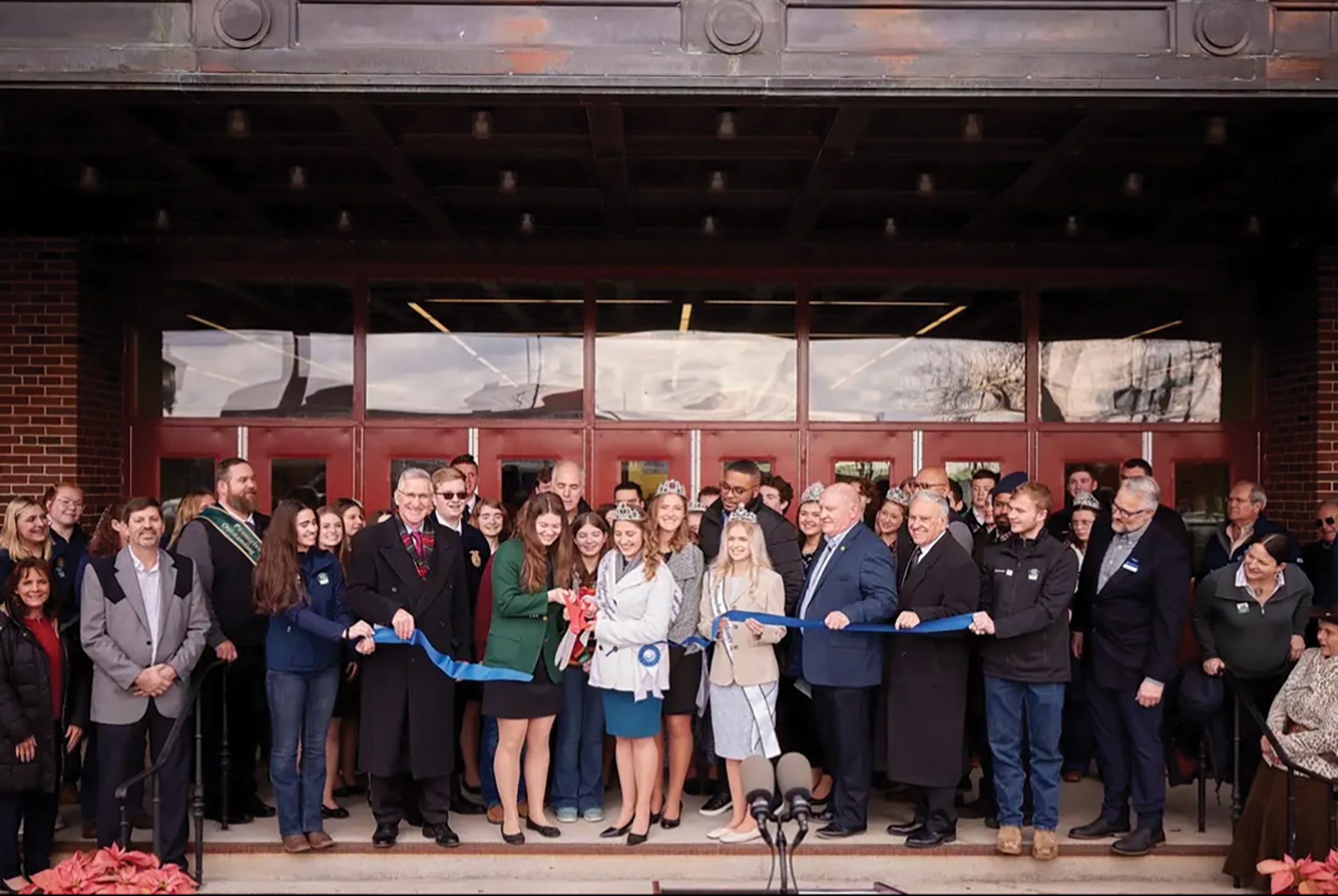 Alice Polcrack, front row, second from left, of Shunk and past president of the 4-H State Council, cuts the ribbon during the opening ceremony of the 2023 Pennsylvania Farm Show.