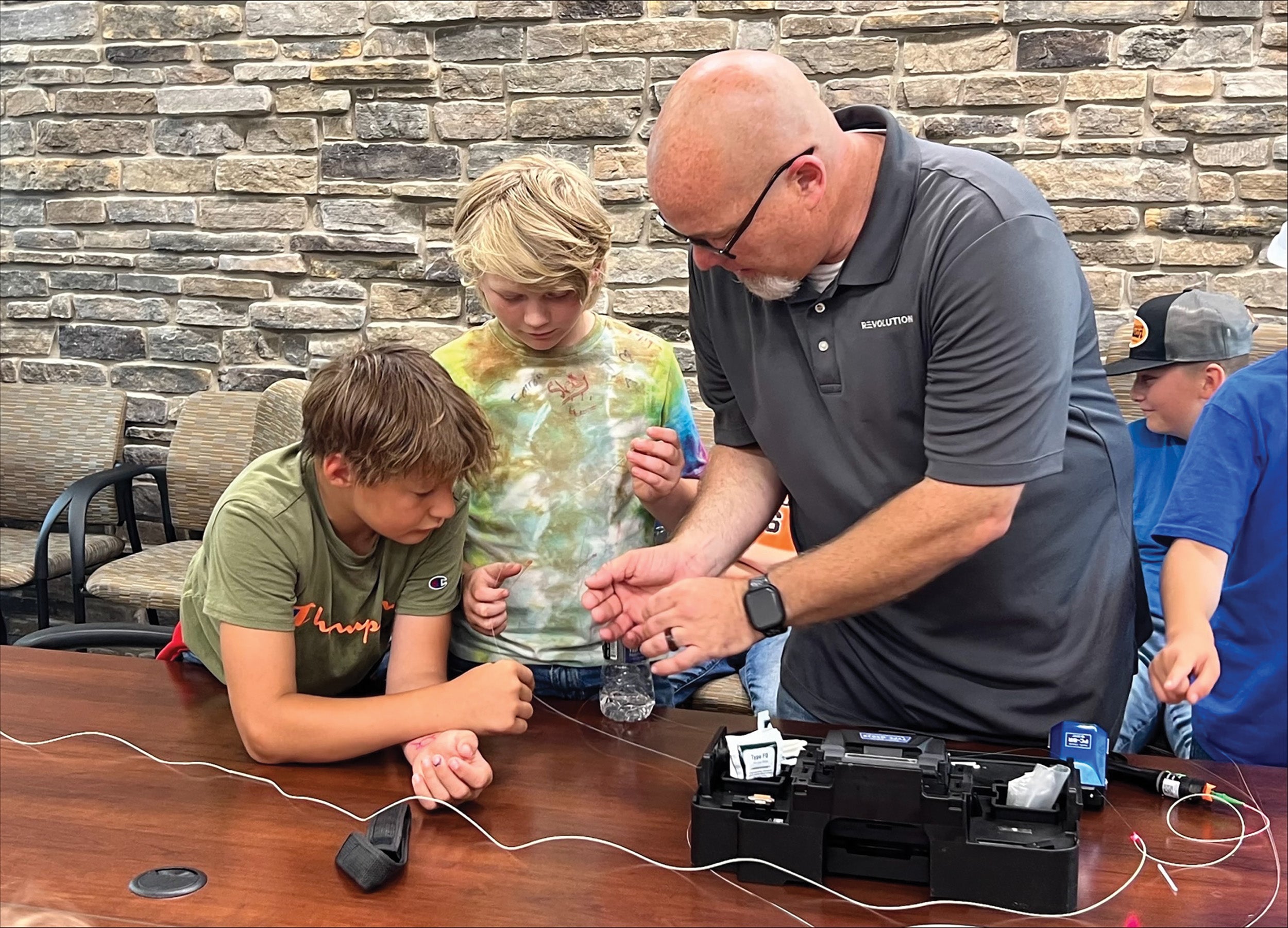 Ryan Chamberlain, communication technician for Revolution Broadband, a subsidiary of Wysox-based Claverack Rural Electric Cooperative, introduces local students to equipment he uses on the job.