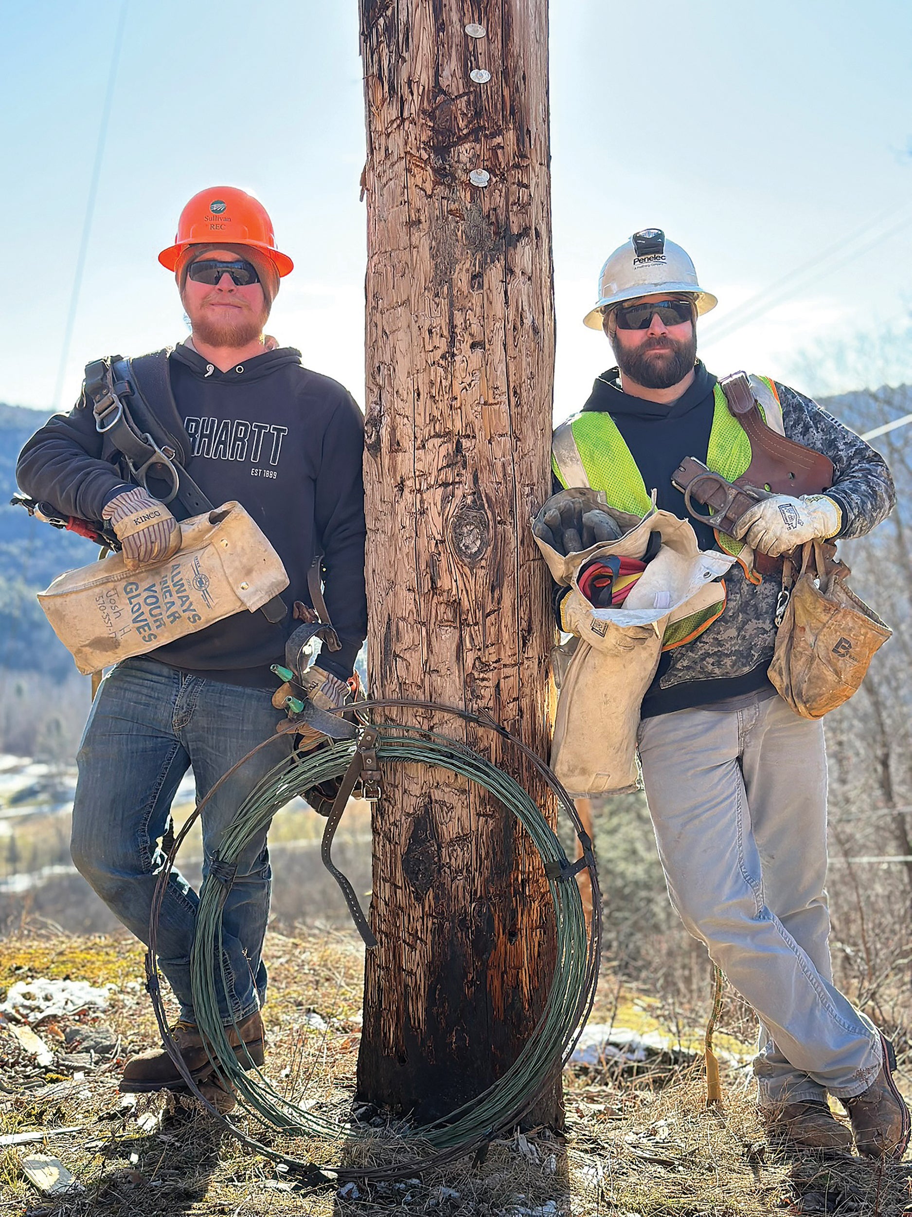 Josh Heess Jr., left, an apprentice lineman for Sullivan County Rural Electric Cooperative (REC) in Forksville, and Josh Heess Sr.