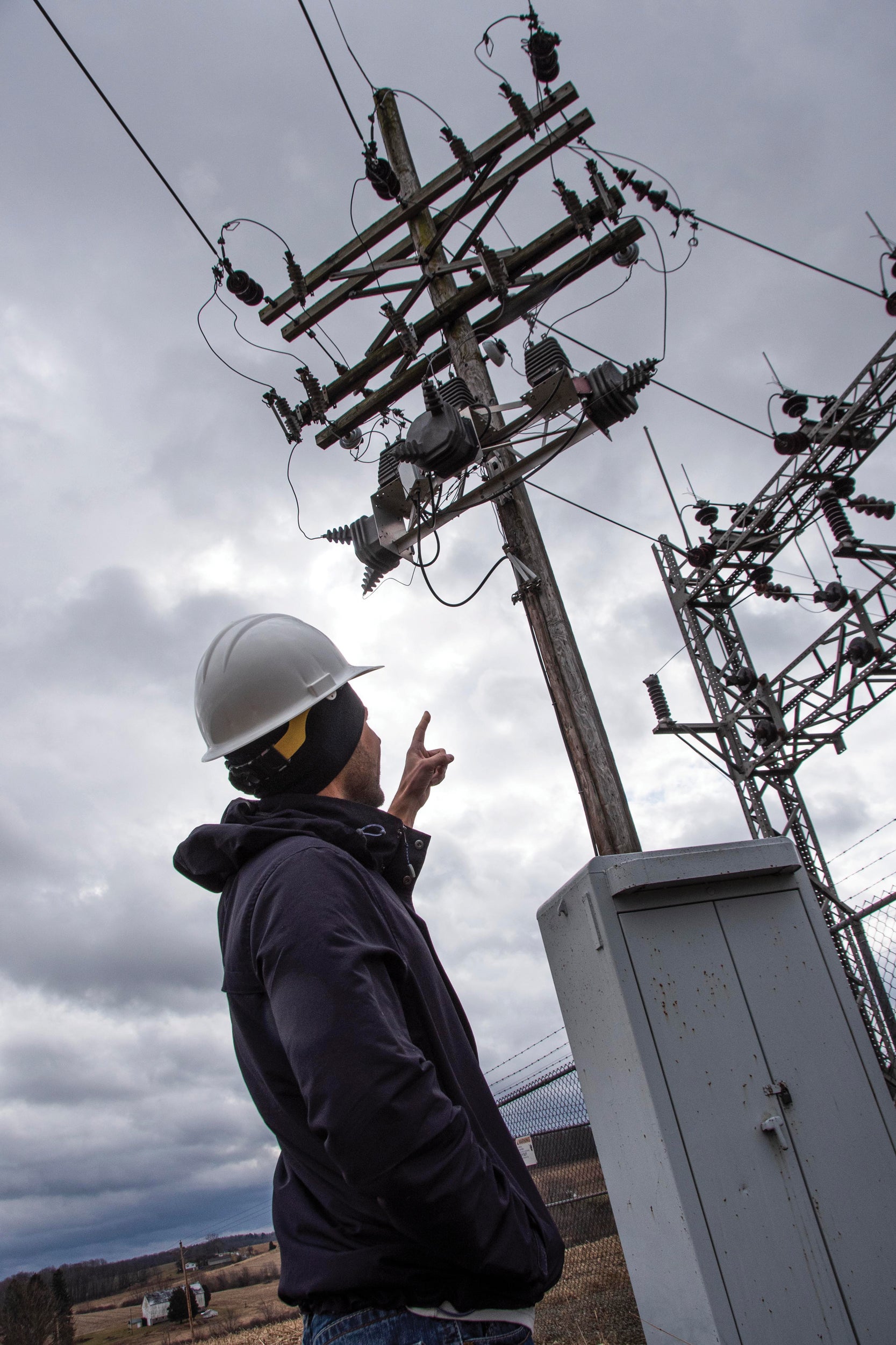 Michael Kovachik, a power delivery engineer, examines transmission lines for potential reliability upgrades.