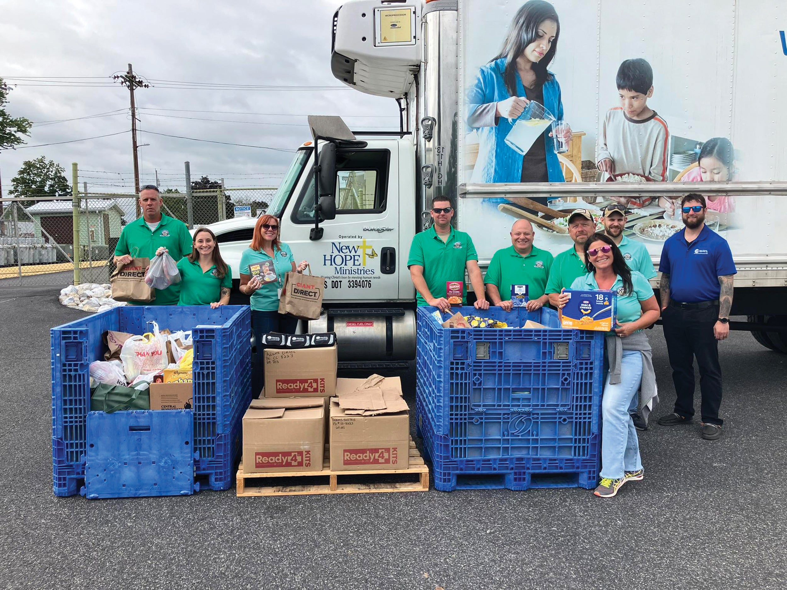 Adams Electric Cooperative asked members attending its drive-thru events to bring food and other donations to support its charitable partner, New Hope Ministries, based in York County. Employees, from left, are: Dan Leonard, Alexis Coscia-Kranias, Georgie Drowsky, Max Rinehart, CEO/General Manager Steve Rasmussen, Tony Spangler, Lisa Willet, Adam Willman and Dan Seibert.